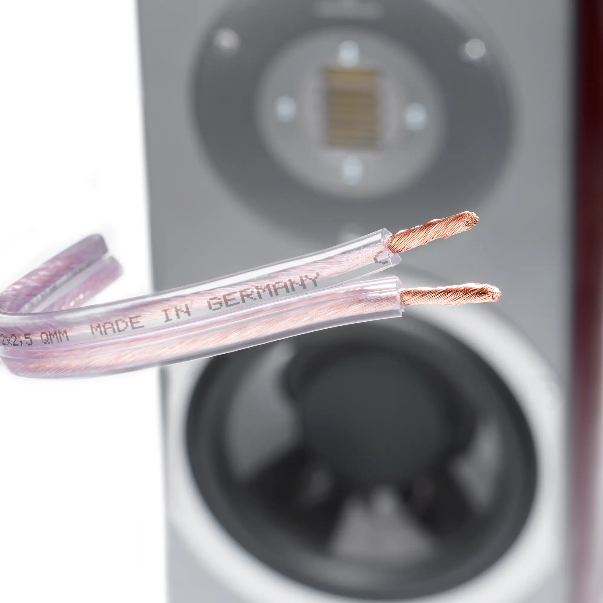 Close-up of the transparent premium copper cable with twisted strands on one side.