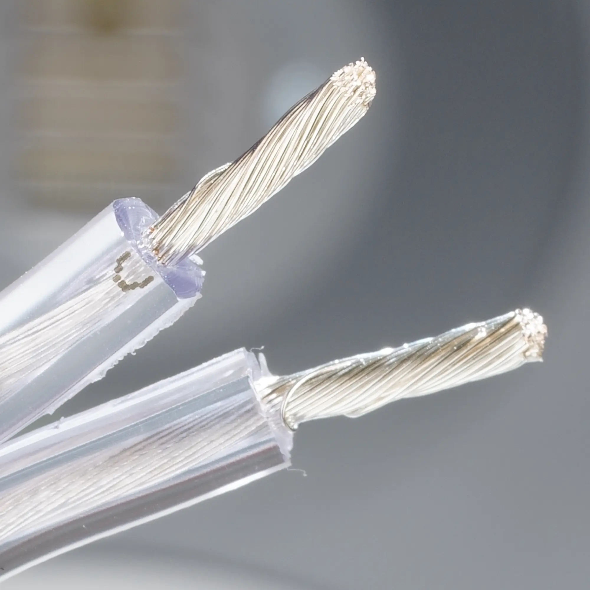 Close-up of the silver cable with exposed silver wires.