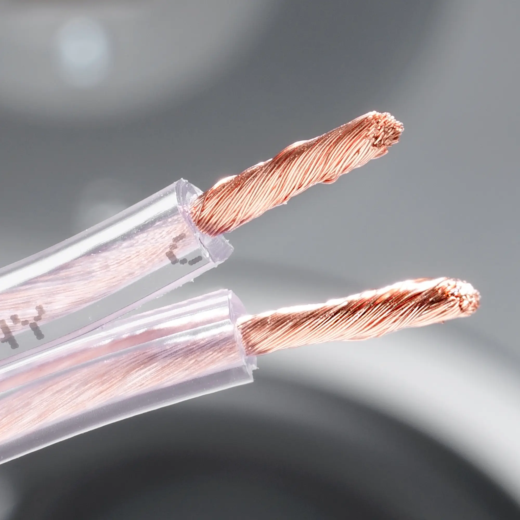 Close-up of the transparent premium copper cable with twisted strands on one side.
