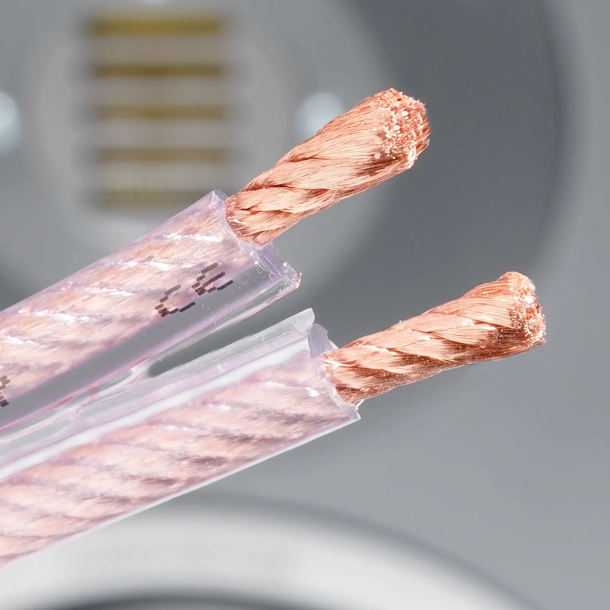 Close-up of the transparent Excellence copper cable with twisted strands on one side.